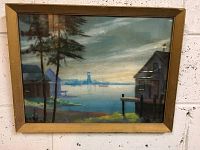 Full view of framed pastel artwork showing a coastal scene with houses, dock and trees.