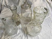 Photo showing all six clear glasspieces arranged on fabric background.