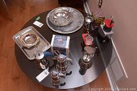 Overview of all coffee makers, coffee press, coffee trays on glass table showing items and packaging