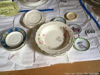 Full view of soup bowls and assorted small plates on display