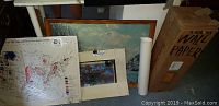 Framed landscape painting, framed map, wallpaper box and poster grouped together