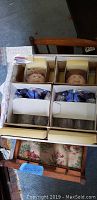 Two boxed Cabbage Patch Kids dolls with accessory package visible
