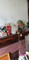 Wide photo of various boxed items on shelf including greenery and flowers