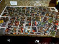 Spread of color-illustrated Civil War News trading cards on counter