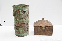 Photo showing vase and trinket box side by side on white background