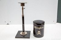 Photo showing entire phosphor jar and adjustable candle holder side by side on white background.