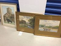 Photo showing all three framed English landscape paintings together leaning against a wall on the floor.
