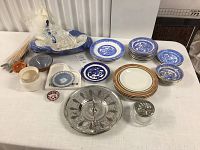 Overview image showing multiple items including Royal Grafton plates, Wedgwood Jasperware pieces, a silver serving dish, bowls, and small plates on a table.