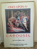 Full view of the framed 'Once Upon A Carousel' print showing the carousel horse artwork and exhibition details.