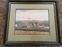 Full view of framed farm print by James Colway on carpet.