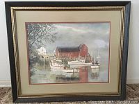 Front view of the framed print showing the harbor with boats and buildings.