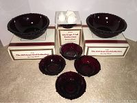 Full set showing five dessert bowls, two serving bowls, and the boxed dessert bowl with soaps on top