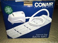Photo showing Conair Thermal Spa Bath Mat box with the spa mat and control unit visible on packaging.
