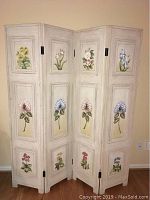Full view of the 4 panel folding screen showing hand painted floral designs on cream crackled background.