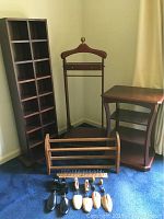 Full lot arranged in corner showing wooden sock and tie cubby, suit stand, side table, three-tier shoe rack, shoe stretchers and tie rack on floor