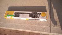 Box of Max Works folding wall-mount tire rack, showing branding and product name.