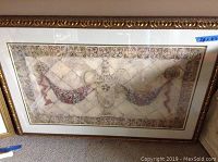 Large framed artwork with decorative pattern, measures 28x43 inches