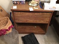 Two Bassett nightstands side by side showing drawer fronts and top surface with visible wood grain.