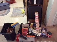 Full lot showing chair, flags, boxes, bucket with tools and supplies
