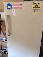 Front view of Kenmore frost-free freezer showing door, handle, energy guide sticker, and frostless freezer label.