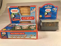 Photo showing full lot with product boxes and windowed packaging of train car Toby number 7.