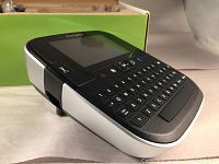 DYMO LabelManager 500TS label maker device, showing front keyboard and touchscreen display, placed on white surface.
