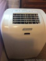 Front view of white Garrison portable air conditioner showing front air vents and brand label.