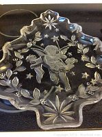 Clear glass serving platter with detailed etched angel figure and star shapes