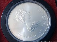 Obverse side of coin showing profile portrait of Queen Elizabeth II with 'Canada 1975' inscription.