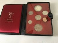 Front view of 6 coin set inside original Royal Canadian Mint packaging. Coins displayed in plastic holder with visible red backing inside fold-over case.