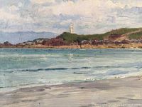 Close-up of water and headland with lighthouse