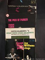 Four black record album covers stacked, titles Sarah Vaughan, Charlie Parker, Getz/Gilberto, Count Basie/Joe Williams visible