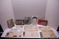 Full view of the lot showing seven Valentine's cards and five bank promissory notes laid flat on a white background.