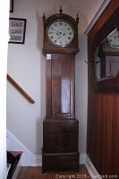 Full front view of entire clock in case