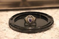 Top view of the ring showing the blue and white enamel Dundas High School crest on a sterling silver ring.