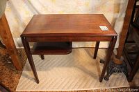 Front view of the wood end side table with visible half shelf below the main surface.