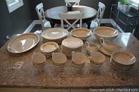 Full view of the 57-piece Royal Knight vintage dinnerware set arranged on a countertop showing plates, cups, bowls, and serving pieces.