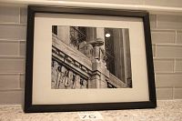 Framed black and white photograph showing architectural details and sculpture, titled 'ROM Literature Allegory'