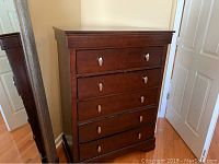 Full front view of tall dresser showing overall design and condition