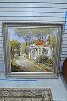 Full front view of the framed oil painting showing a house with trees.
