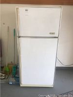 Full view of white Eaton Viking refrigerator with top freezer, showing overall condition and design.