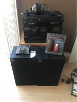 Full lot including stacked Symphonic DVD player, JVC receiver, JVC cassette player, Wharfedale speakers, headphones on top, and Discwasher D4 record care system on speaker.