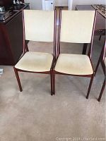 Front view of both chairs showing overall design and upholstery