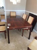 Table assembled without extension leaves installed, showing overall form and finish