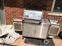Front view of Weber Genesis Platinum grill on deck