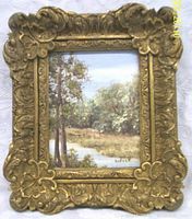 Frontal image of the framed oil painting showing the landscape scene, signed by Radeck.