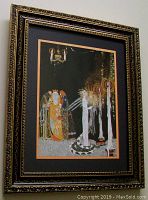 Angled view of full framed print showing dark ornate frame and visible artwork inside with characters in detailed costumes.