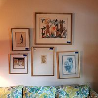 Overview of five framed art prints: silhouette, color figurative scene, blue bird, small cubist figures, geometric still life
