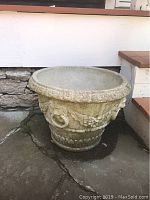 Full view of one concrete planter showing shape and size
