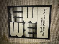 Photo of Einstein Moomjy label on the backing of one rug